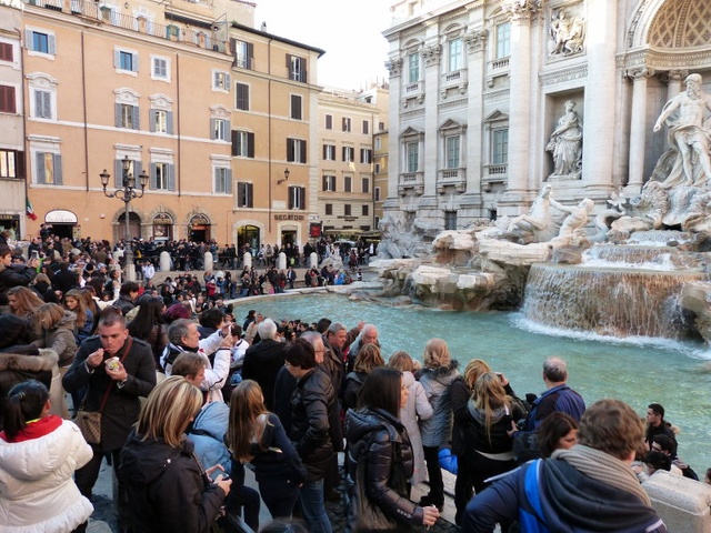 People at the Trevi fountain