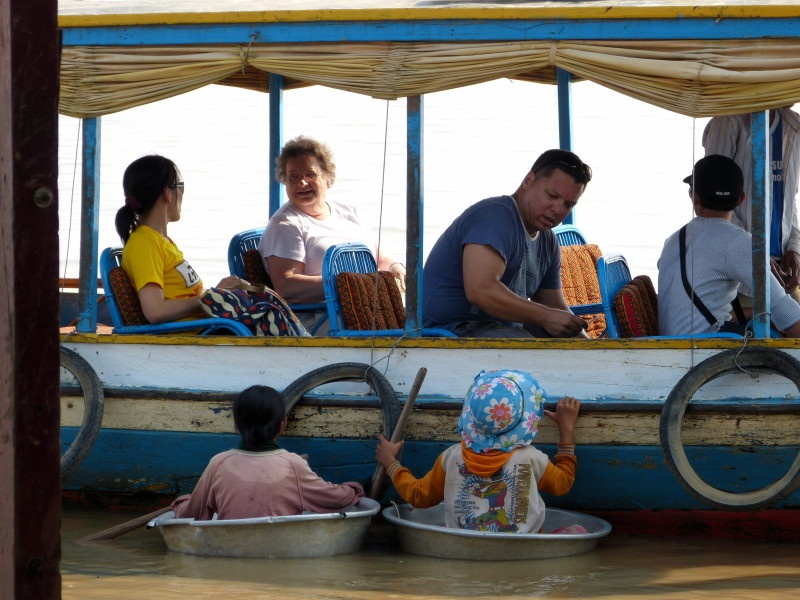 Children begging money from the tourists.